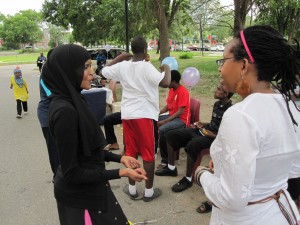 Julia Opoti (right) speaks with a forum member